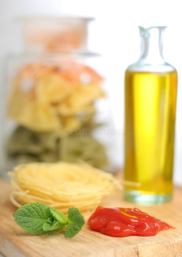 Pasta with oil bottle and ketchup