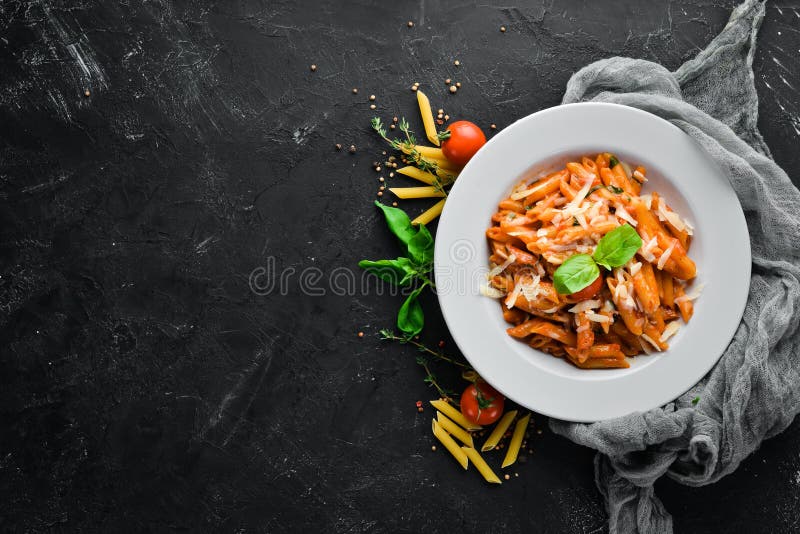 Pasta Pene with Bacon and Cherry Tomatoes. Italian dish Free space for your text.