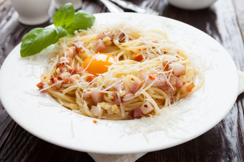 Pasta with pieces of bacon and parmesan