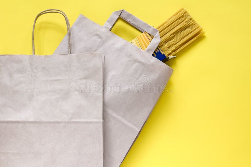 Download Pasta In Recycled Brown Paper Shopping Bag With Handle, On Yellow Background, Flat Lay, Mockup ...