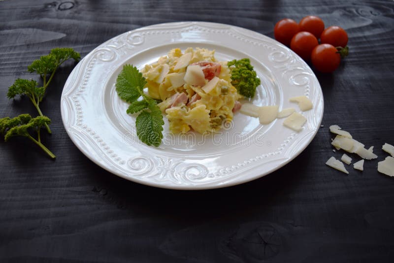 Pasta Salad with Cheese with Peas, Corn, and Tomato Stock Photo - Image