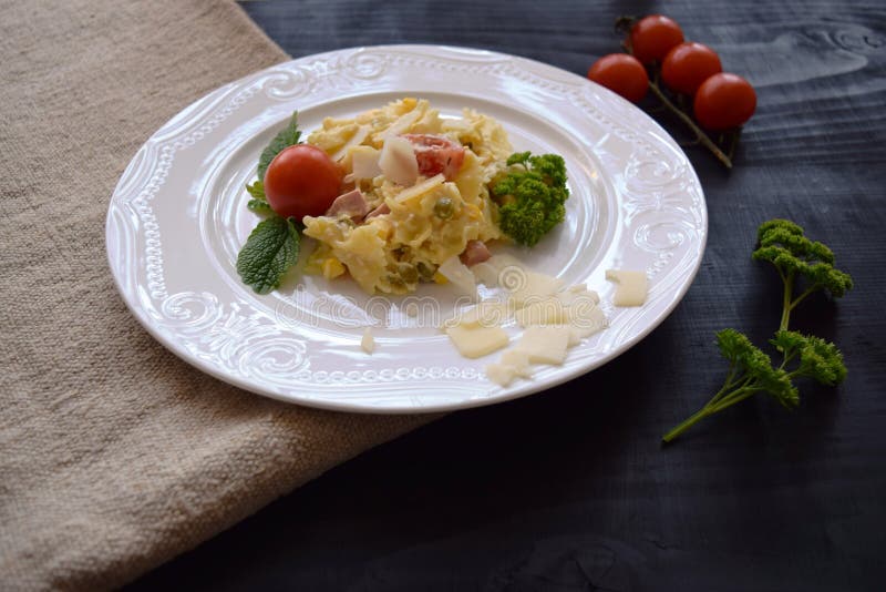 Pasta Salad with Cheese with Peas, Corn, and Tomato Stock Photo - Image