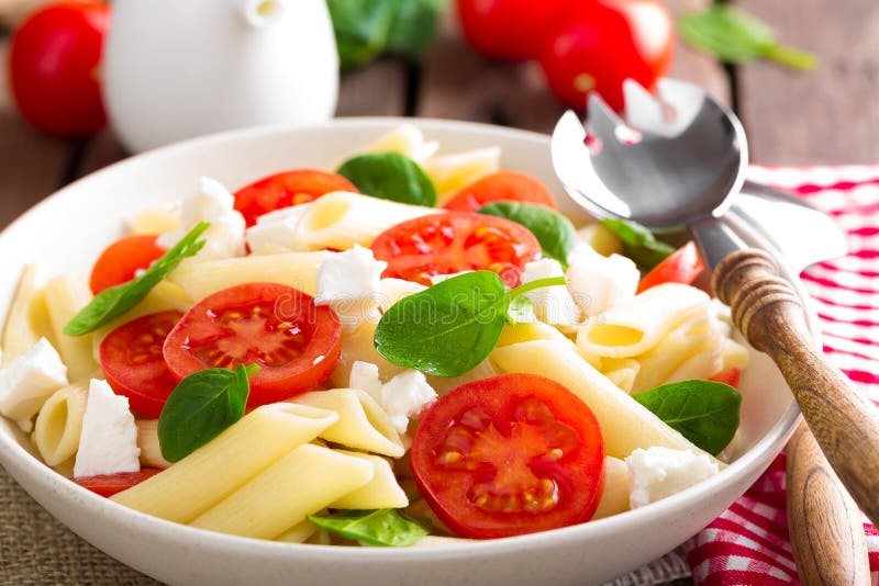 Pasta salad with fresh red cherry tomato and feta cheese