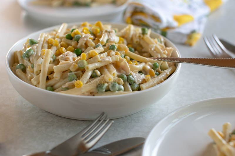 Pasta Salad with Mayonnaise, Corn, Green Peas, Ham and Boiled Eggs in a
