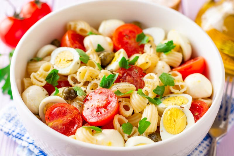 Pasta Salad with Quail Eggs, Mozzarella, Cherry Tomatoes and Capers in ...