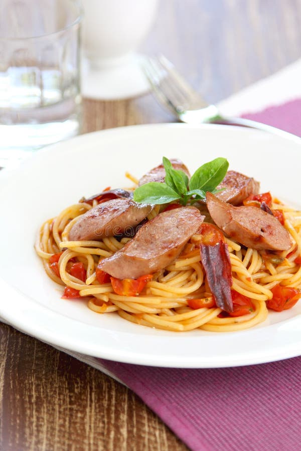 Pasta with sausage and tomato