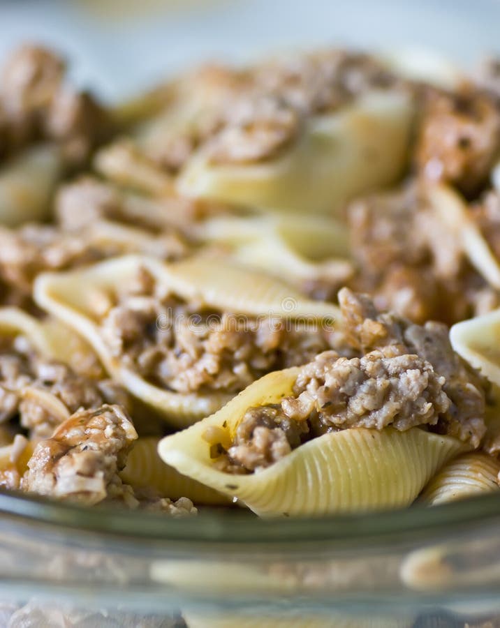 Plate of pasta shells stuffed with meat.