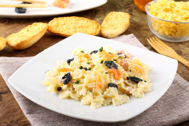 Pasta with smoked salmon and caviar stock photo