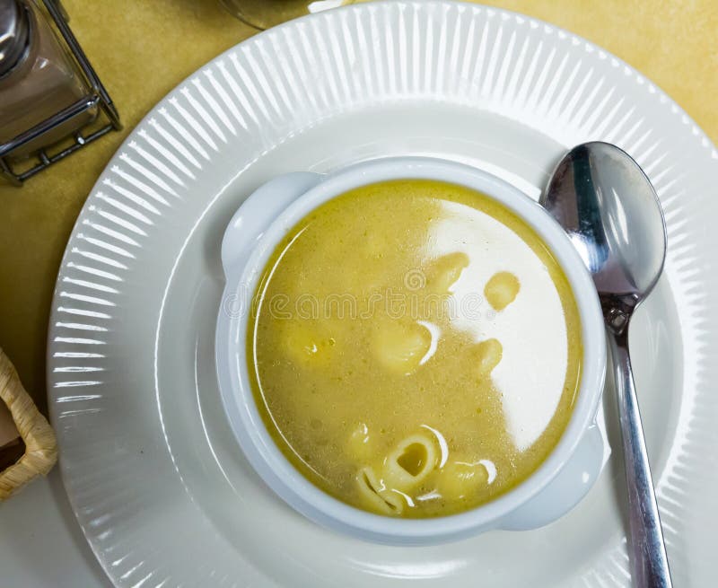 Pasta soup served in bowl stock images