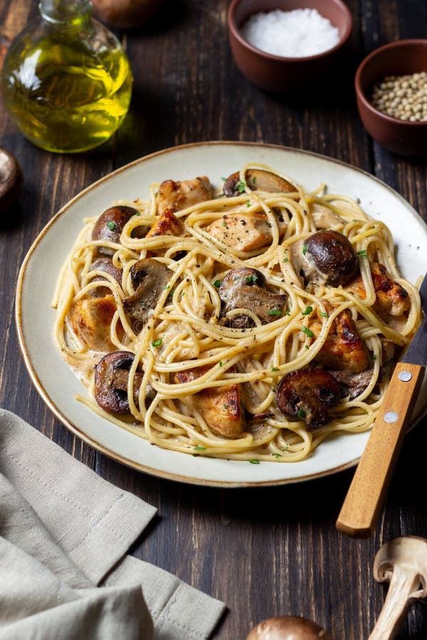 Pasta Spaghetti in a Creamy Sauce with Chicken and Mushrooms. Italian