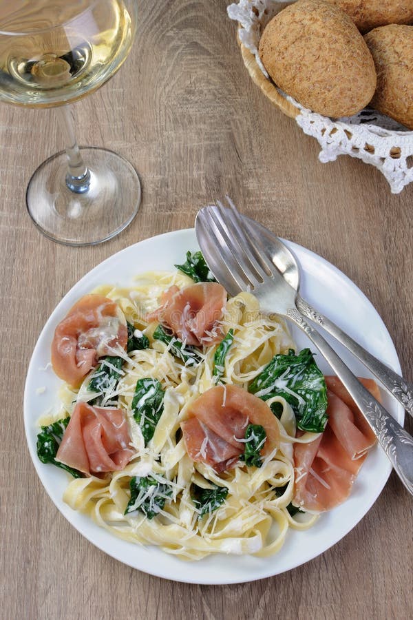 Pasta with spinach and ham stock photo. Image of gammon 61120092