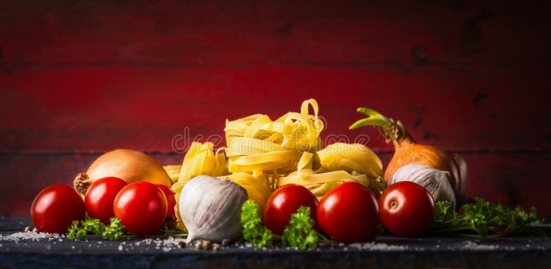 Pasta tagliatelle with tomatoes, herbs and spices for tomato sauce