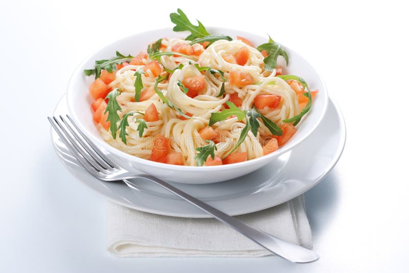 Pasta with tomato and rucola