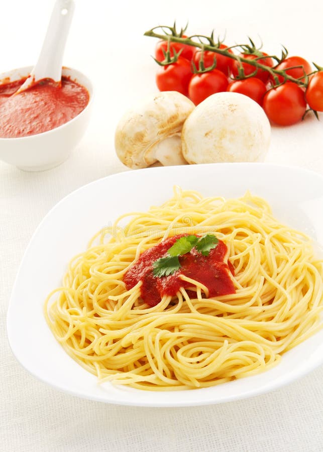 Pasta with tomato sauce basil and grated parsley