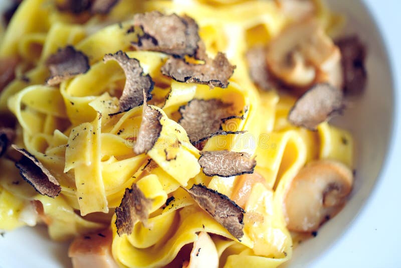 Pasta with truffles, typical autumn dish.Restaurant menu dish.