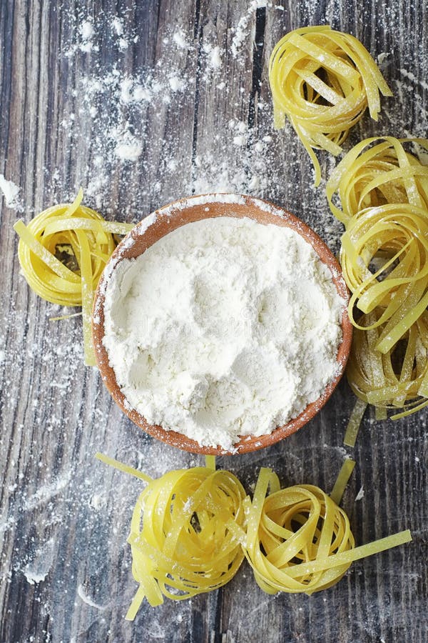 Pasta uncooked on the table. Noodles in the form of nests stock photography
