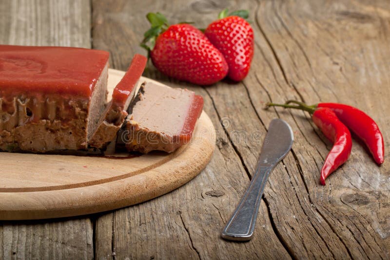 Pate Apetiser with strawberry jally, fresh strawberry and red hot chili peppers on old wooden table. Pate Apetiser with strawberry jally, fresh strawberry and red hot chili peppers on old wooden table