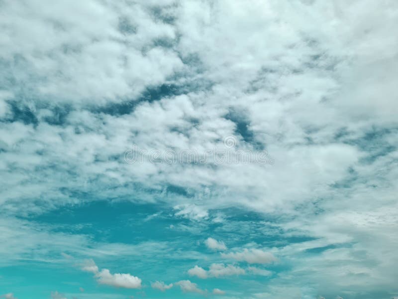 Pastel Blue Sky and Clouds. Bright Sweet Sky Concept Stock Photo