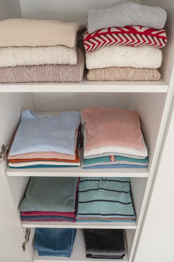 Pastel Clothes Folded on Shelves in Wardrobe Stock Photo Image of