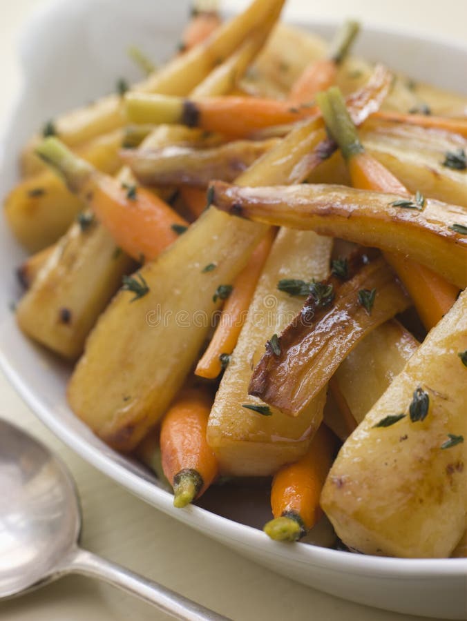 Parsnips and Baby Carrots Roasted in Thyme and Honey. Parsnips and Baby Carrots Roasted in Thyme and Honey