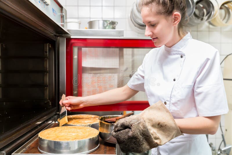 Pastry Baker Putting Pies or Cakes in Oven Stock Photo Image of