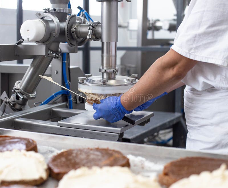 The Pastry Chef Makes Cake Using Modern Equipment For The Production Of