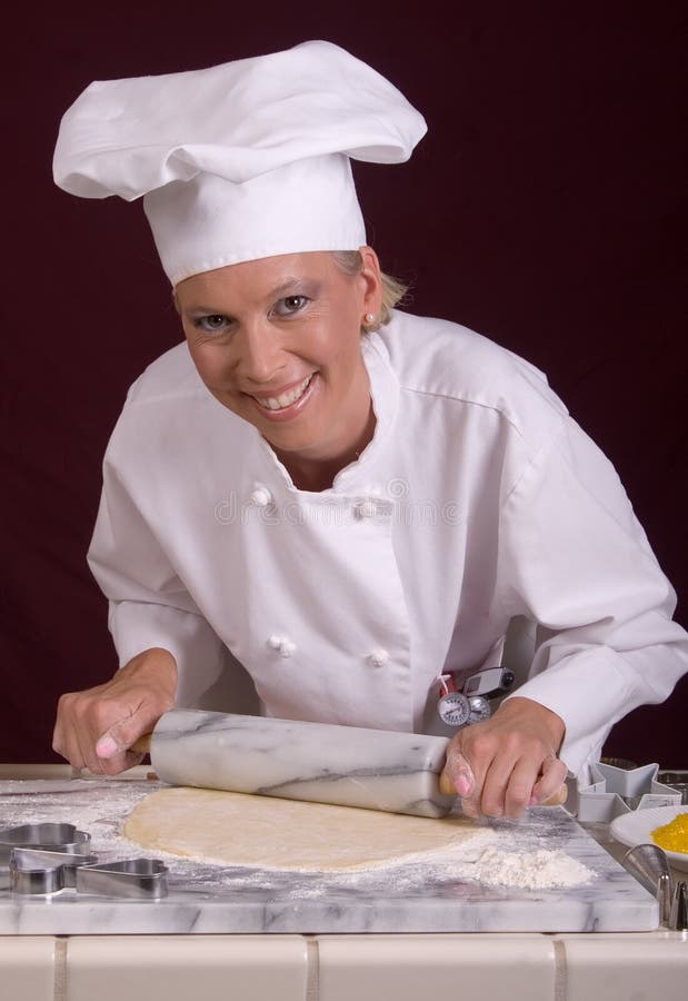 Pastry Chef Rolls Dough royalty free stock image Pastry Chef Rolls Dough royalty free stock image