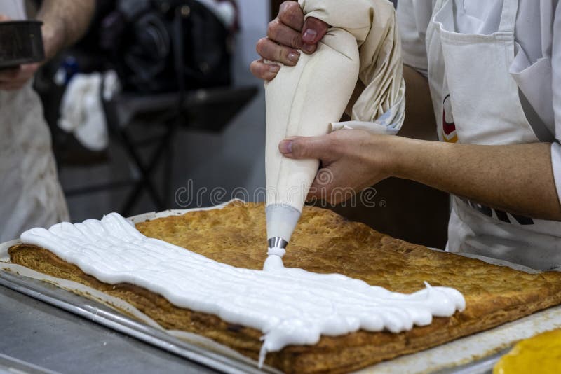 Pastry Decorating Cake with Cream in a Pastry Shop Stock Photo Image