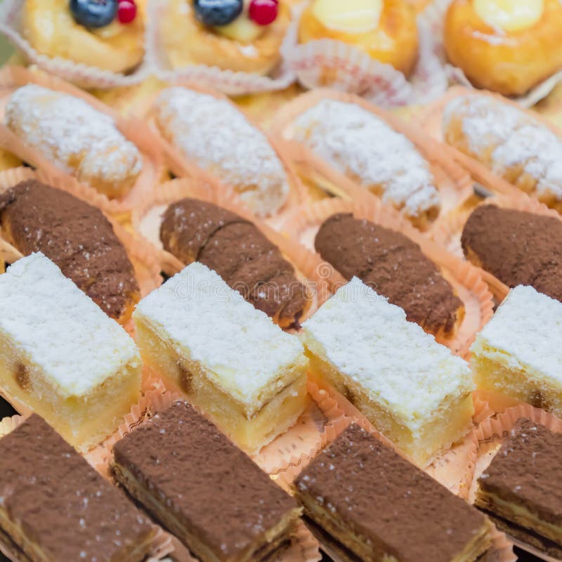 Pastry shop display window with variety of mini desserts and cakes, selective focus royalty free stock photo Pastry shop display window with variety of mini desserts and cakes, selective focus royalty free stock photo