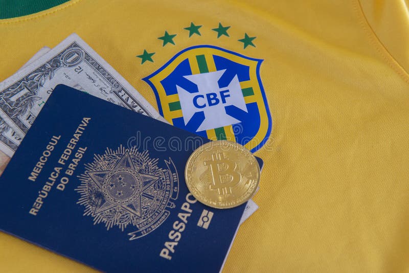 Bauru, Brazil - 11.01.23: Brazilian Football Confederation emblem on football jersey. Soccer players sale and trading concept. Passport and money from fans or players on the Brazilian team t-shirt. Bauru, Brazil - 11.01.23: Brazilian Football Confederation emblem on football jersey. Soccer players sale and trading concept. Passport and money from fans or players on the Brazilian team t-shirt