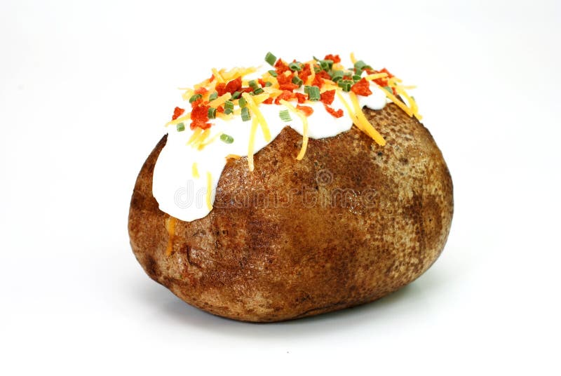 Baked potato loaded with butter, sour cream, cheddar cheese, bacon bits, and chives. Isolated on white background. Baked potato loaded with butter, sour cream, cheddar cheese, bacon bits, and chives. Isolated on white background.