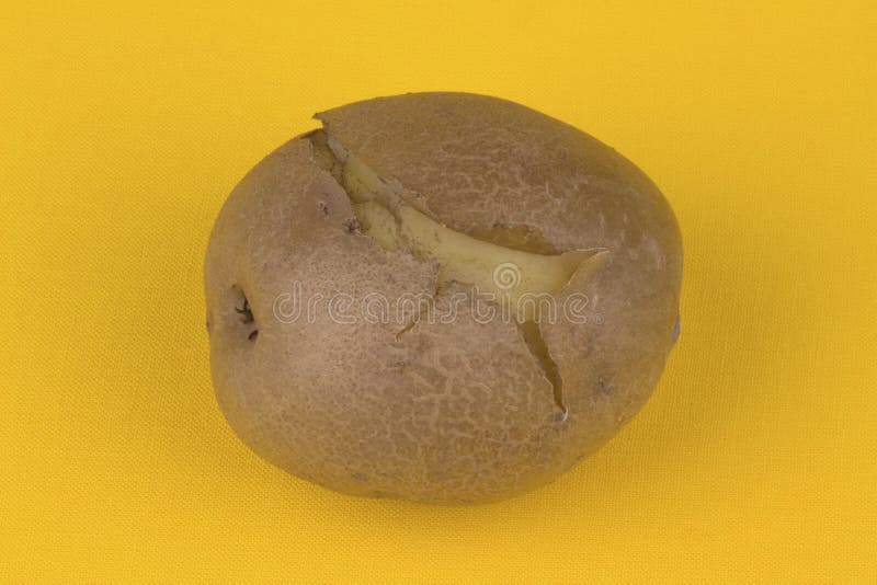 Hot boiled potato on a yellow tablecloth. Hot boiled potato on a yellow tablecloth.