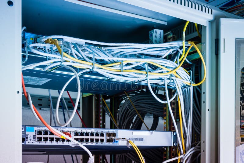 Patch cables connected to data router stock photography