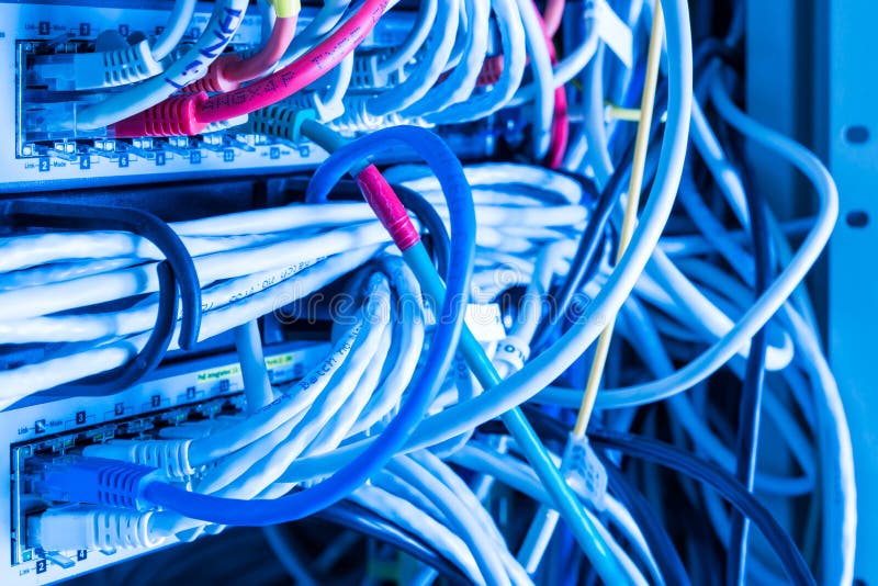 Patch cables connected to data router stock photography