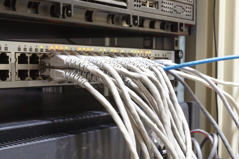 Patch Panel server rack with gray cords in the background royalty free stock image Patch Panel server rack with gray cords in the background royalty free stock image