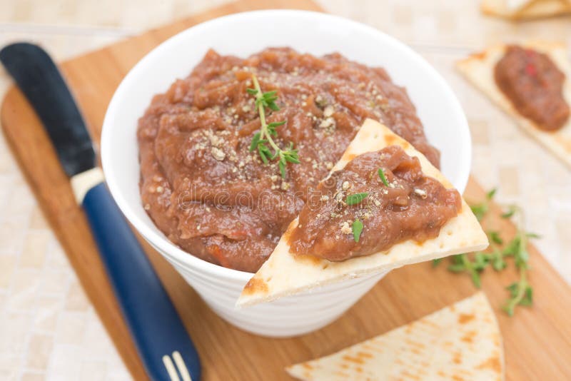 Pate of roasted eggplant and tomato on a piece of pita bread