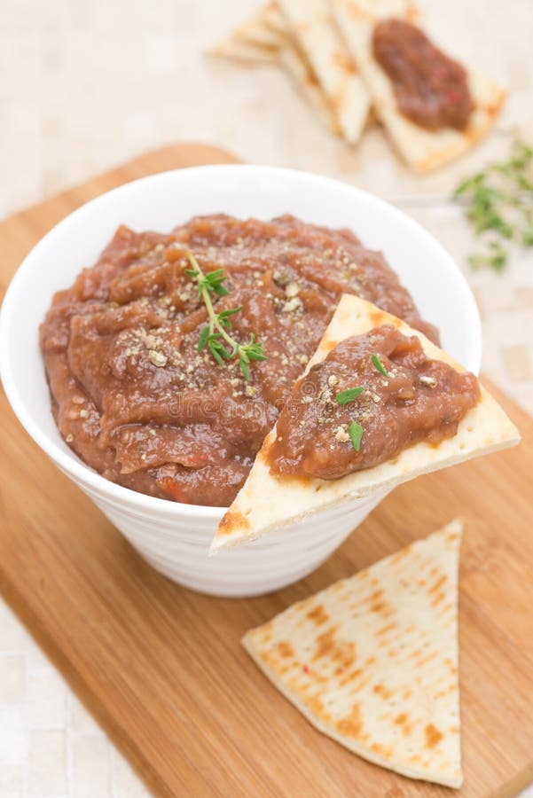 Pate of Roasted Eggplant and Tomato on a Piece of Pita Stock Photo