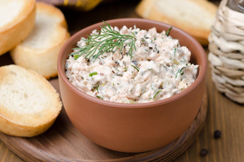 Pate of smoked fish with sour cream and herbs, close-up