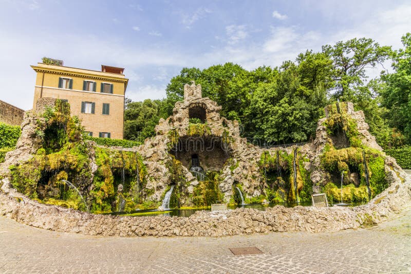 A Path in a Garden in Rome with Old Statues, Columns, and Water