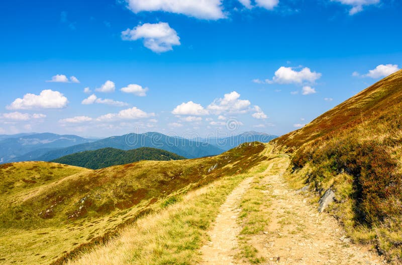 Path through a meadows of mountain ridge