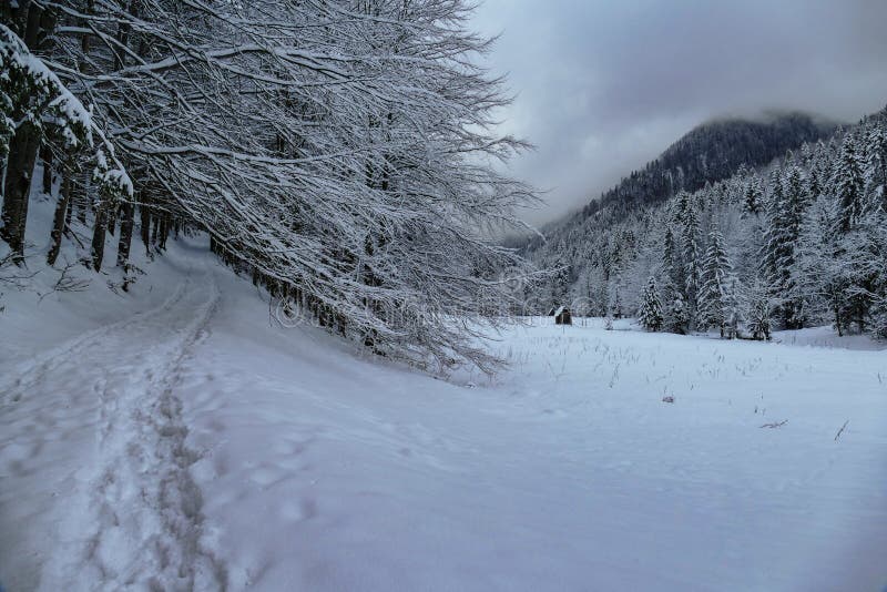 Winter mountain view with path and building. stock image Winter mountain view with path and building. stock image