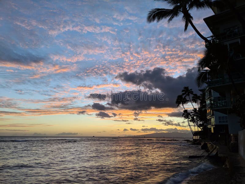 Golden Glow: Dusk Descends on Waikiki's Ocean Path, Illuminating the Serene Waters on a Beautiful Evening. Captivating path stock images, royalty-free photos and pictures