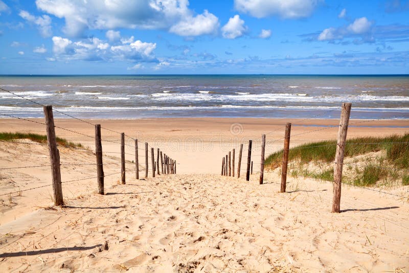 Path to sandy beach by North sea in Zandvoort aan Zee