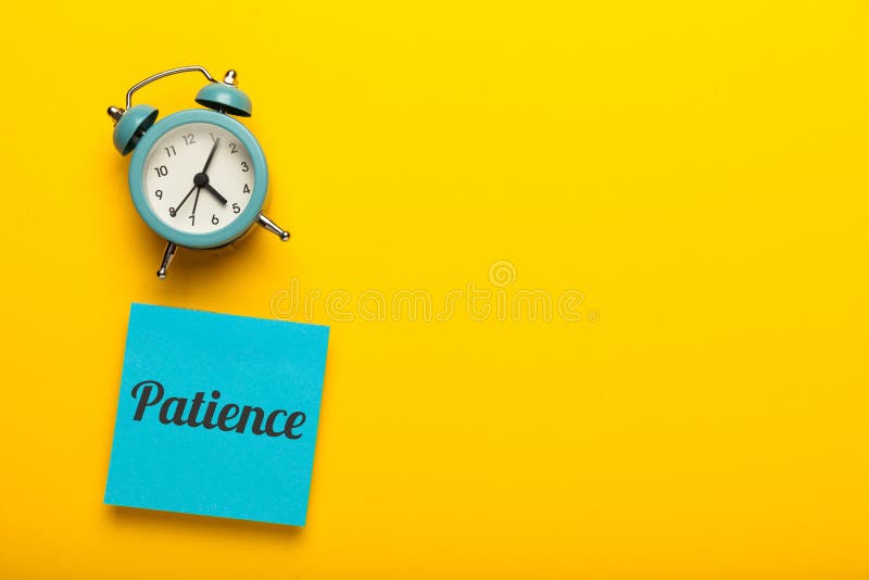 Patience concept, waiting time. Yellow background