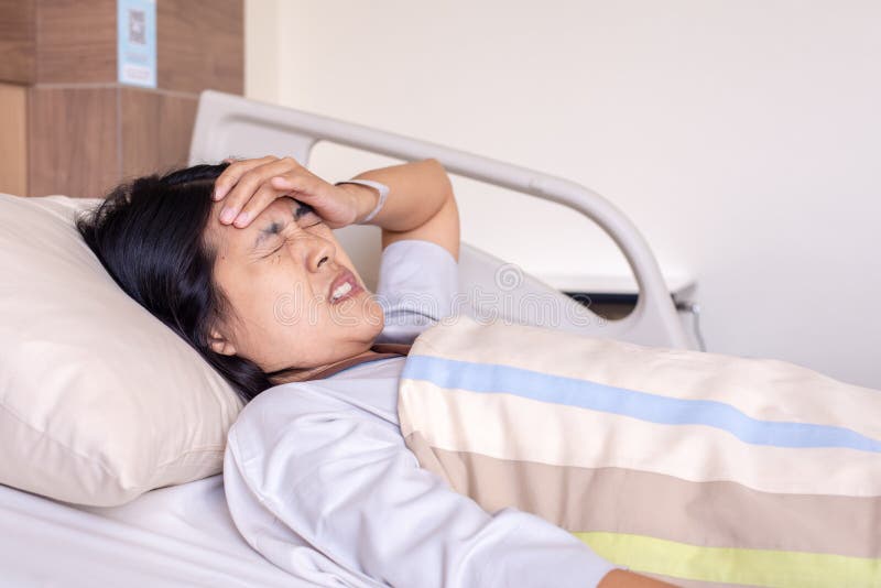 Patient Asian Woman Having A Headache Or Migraine Severe In Hospital 