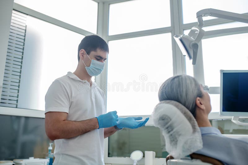 Patient and a Dentist in the Dentists Office Ready for the Surgery