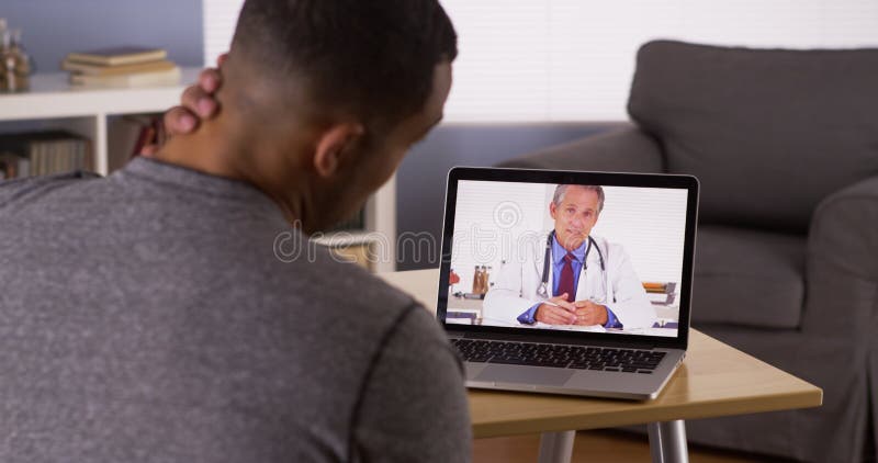 Patient discussing health problems with doctor online stock photo