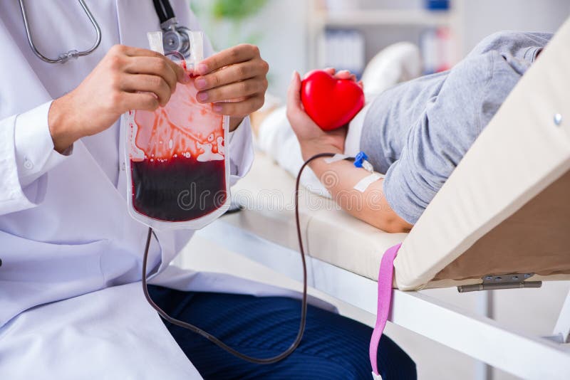 The Patient Getting Blood Transfusion in Hospital Clinic Stock Image