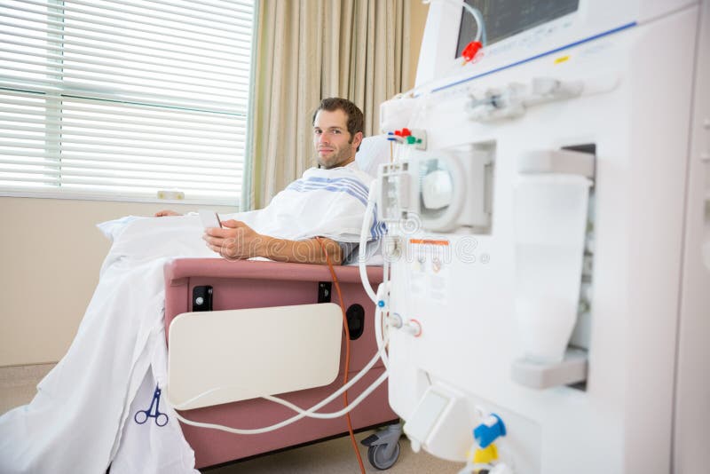 Patient Holding Cellphone During Renal Dialysis