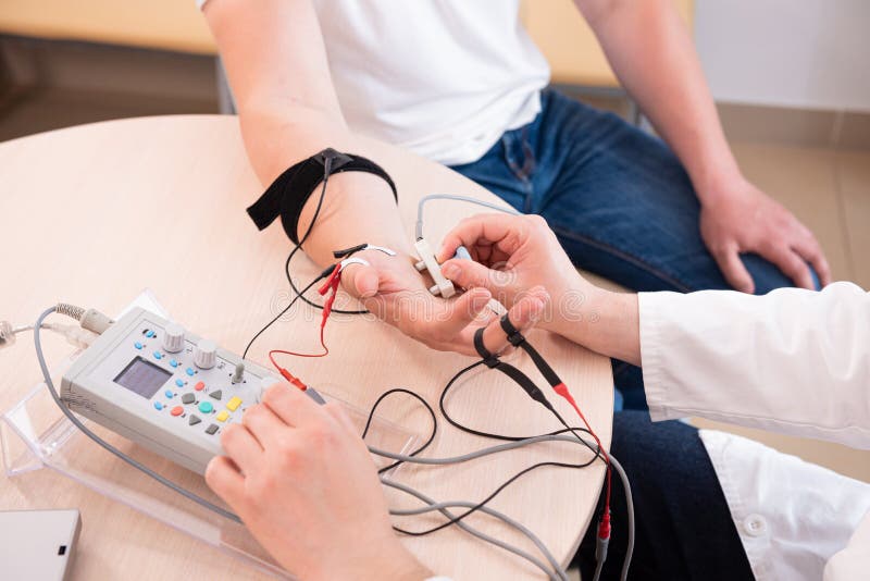 Patient Nerves Testing Using Electromyography at Medical Center Stock